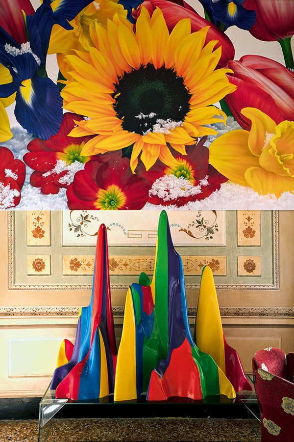 Colorful abstract sculpture by Sol LeWitt and large-scale floral photograph in the Byblos Art Hotel hall