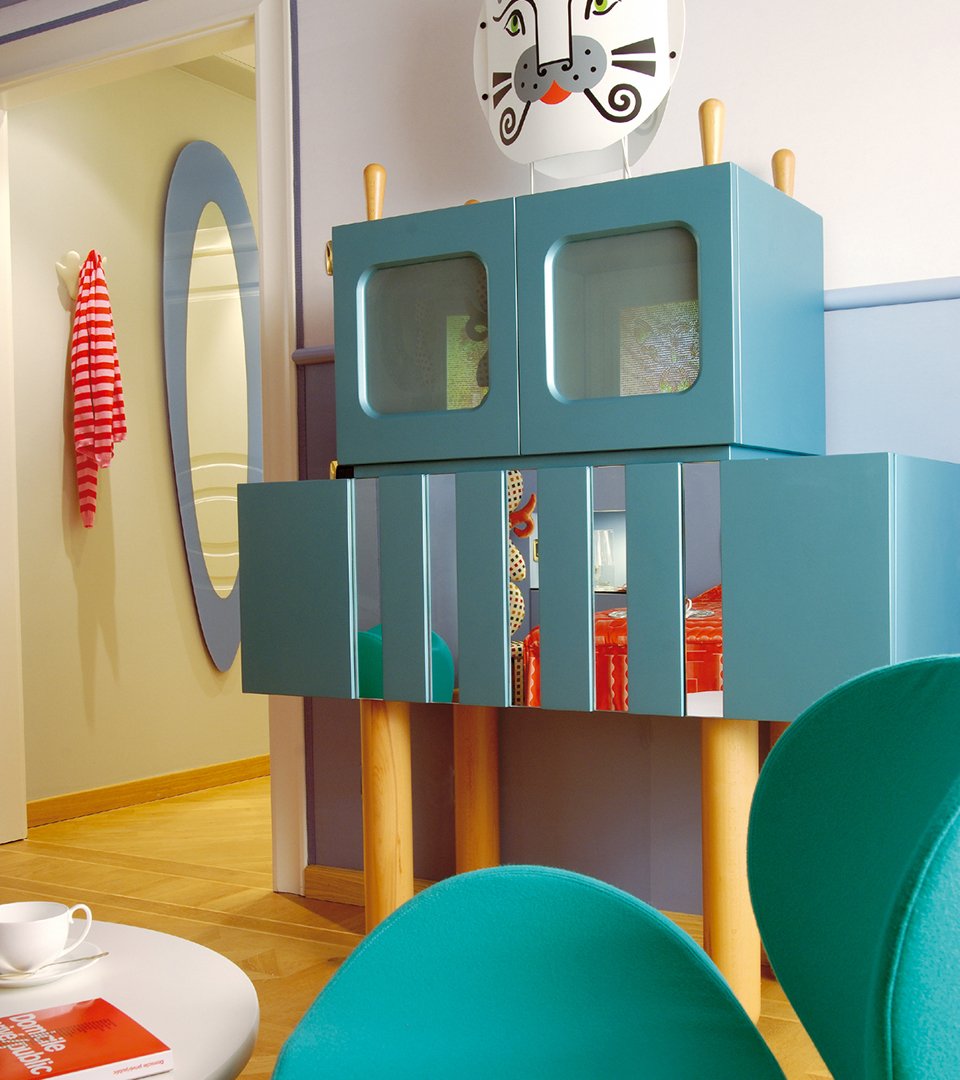 Detail of the Concept Suite designed by Alessandro Mendini, featuring eclectic furniture and a vibrant color palette