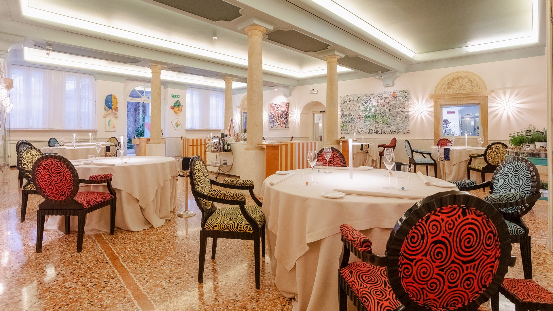 Detail of the dining room at Restaurant Amistà with artworks and bright atmosphere