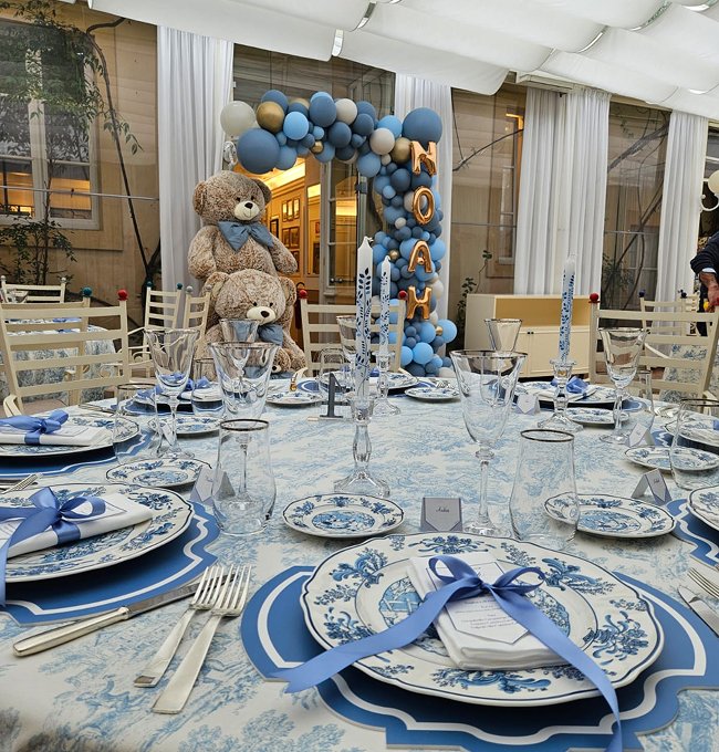 Decorated table for private party with baby shower theme