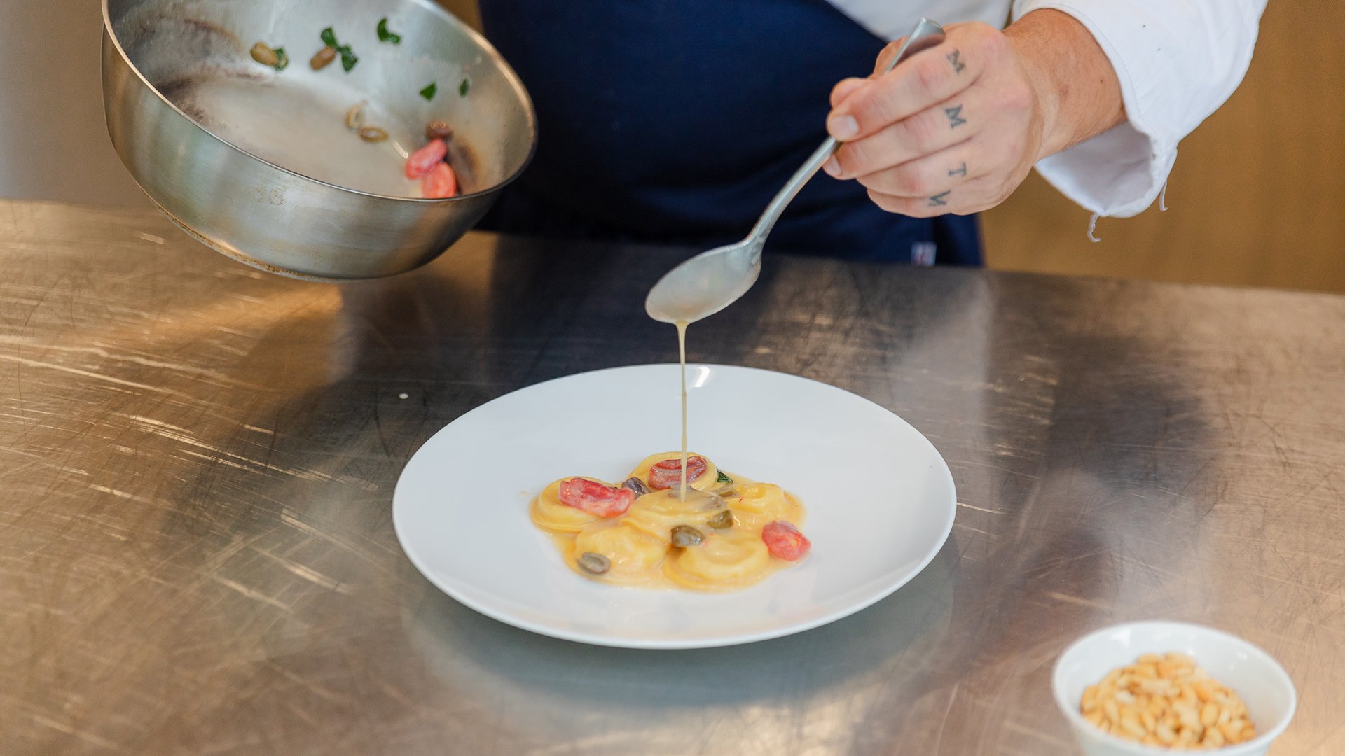 Preparation of a gourmet dish in Saor's kitchen
