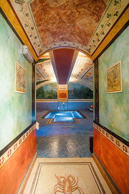Entrance to the spa with view of the indoor pool and decorative wall details