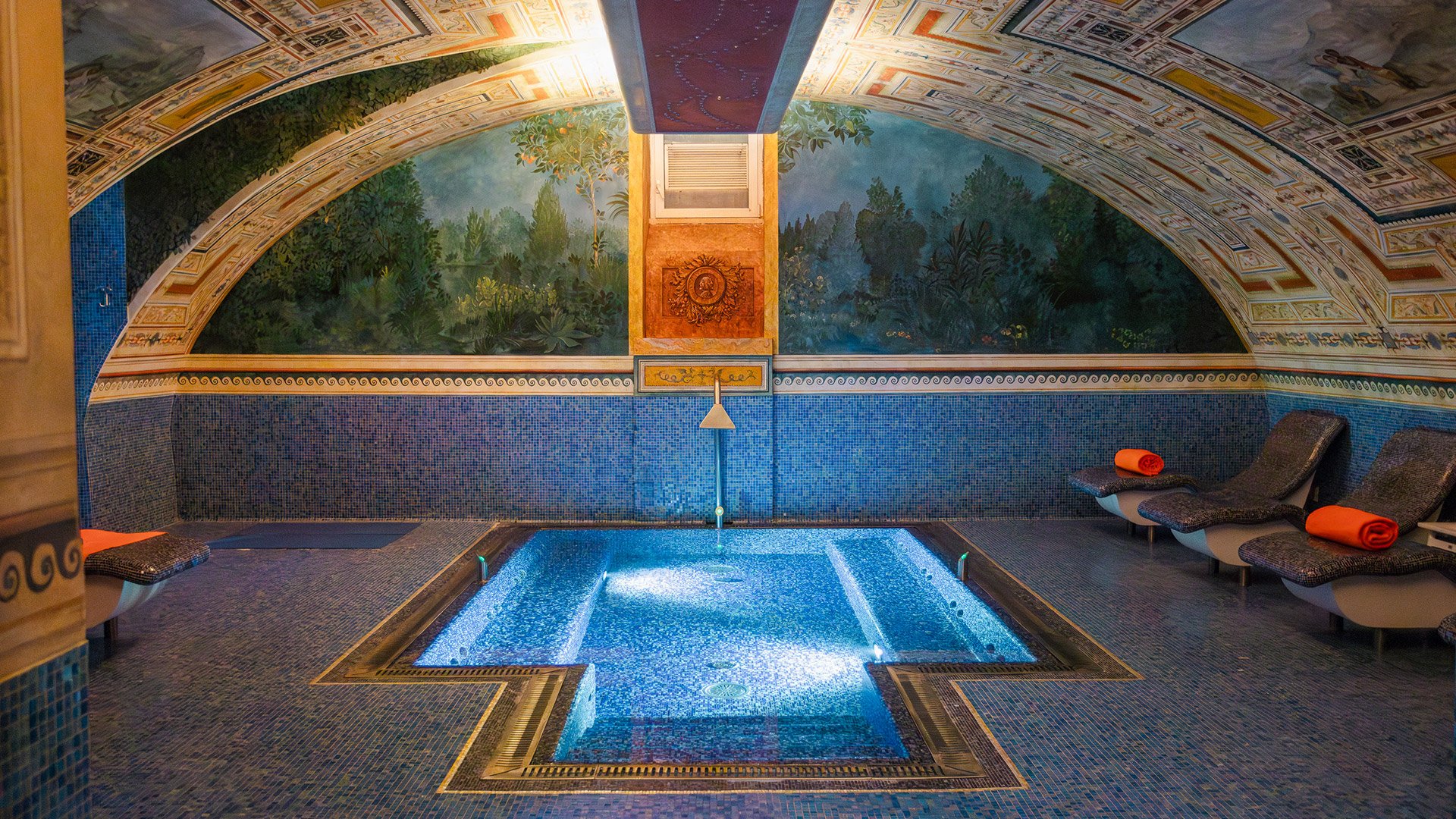 Hot tub in the spa of Byblos Art Hotel, set in an elegant space with frescoed vaults and relaxation loungers